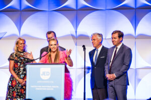 Christina Huntsman Durham and family at podium at gala
