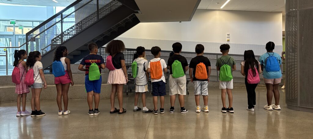 Students wearing backpacks